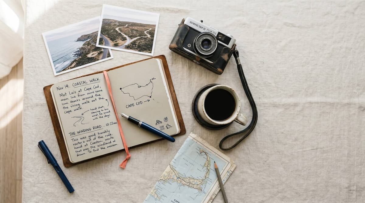 A phone showing a chronological travel journal next to a phone showing an Instagram grid